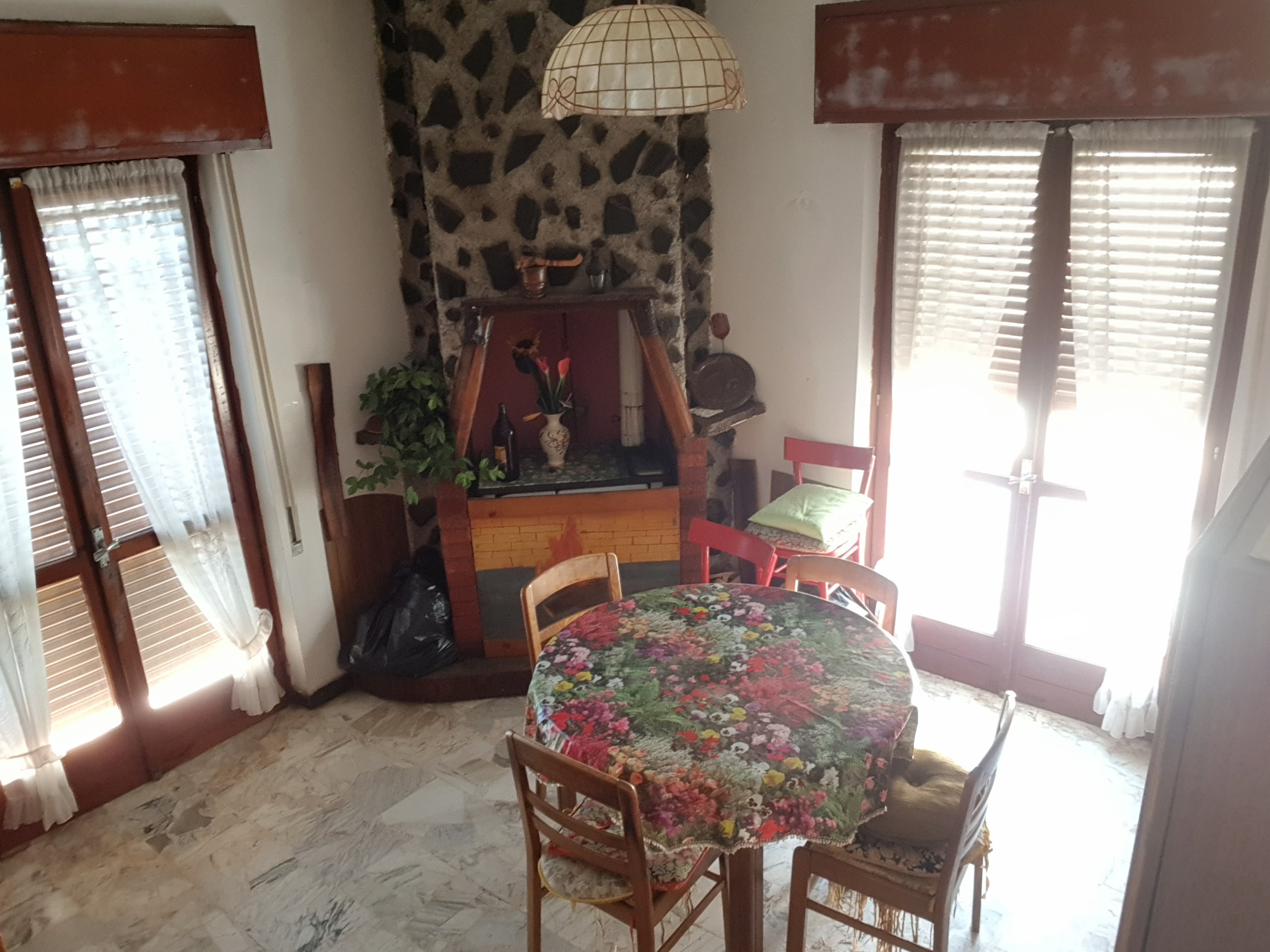 Room with stone fireplace — Building B