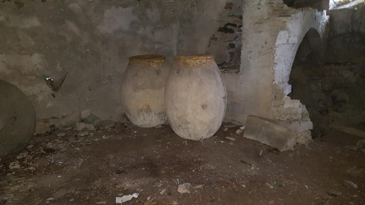 Terracotta jars in the mill cellar